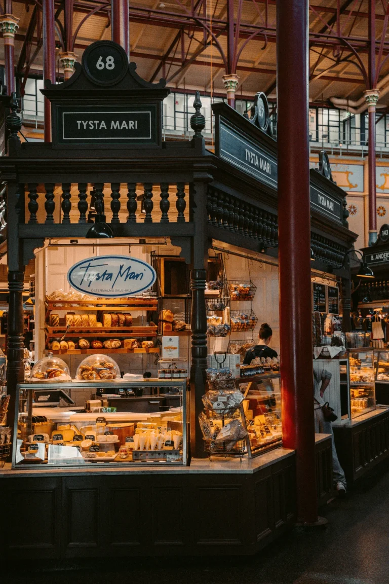 Warm interior of Tysta Mari bakery in Ostermalm Saluhall showcasing fresh pastries and breads